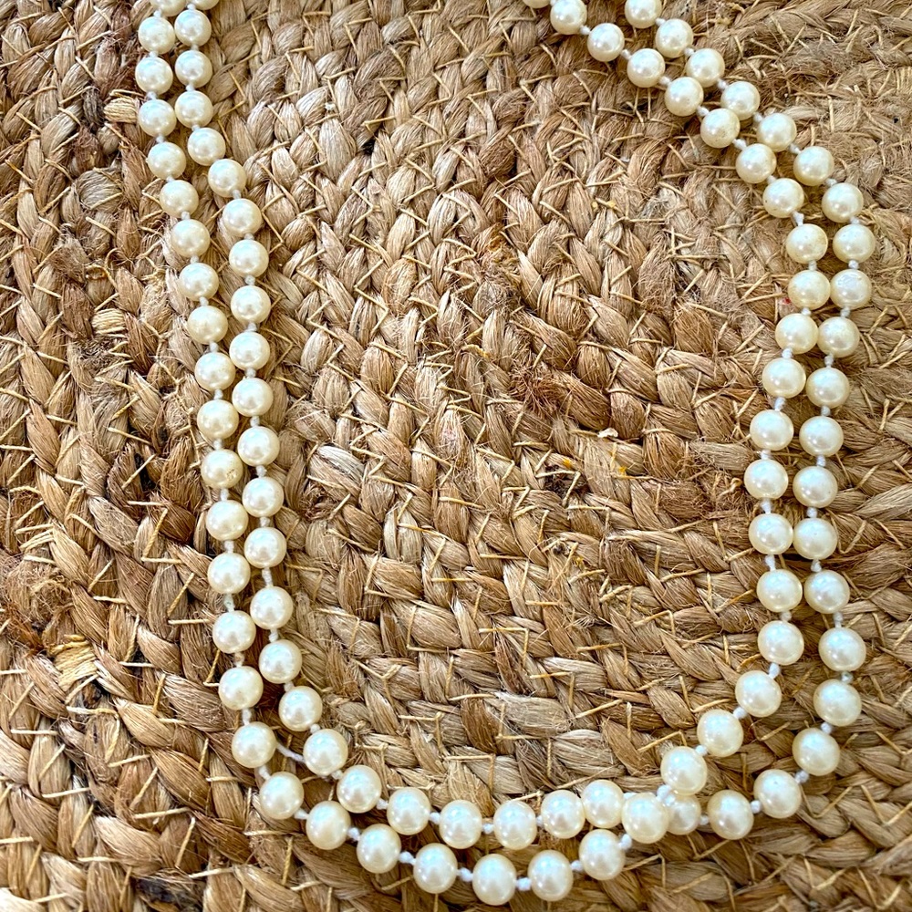 Double strand imitation pearl strand necklace.